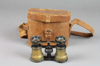 A pair of brass opera glasses complete with leather carrying case 