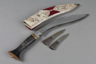 A Kukri with 10" blade and 2 skinning knives contained in a "silver" and plush scabbard