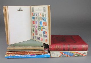 A red Triumph album, 2 Wanderer albums, a Royal Mail stamp album, a Stanley Gibbons Trans World album, a Universal D Timbres-Poste, an Atlas stamp album and a Jet Age stamp album