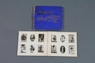 2 albums of Ogden Guinea Gold cigarette cards