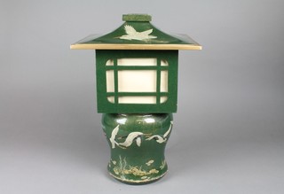 A Chinese green lacquered table lamp in the form of a lantern, decorated storks 17"h x 12" x 12"