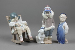 2 Lladro figures - a boy with a Polar bear cub 6" and a girl and doll in a rocking chair 5", a Danish figure of a young boy 3250 4" 