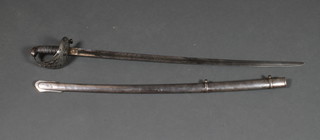 A Victorian heavy cavalry sword and scabbard by Henry Wilkinson, the etched blade with Royal Cypher and complete with scabbard