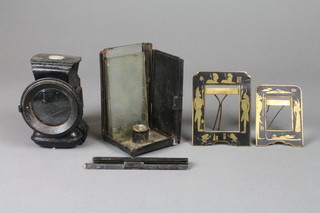 A 19th Century Demon bicycle lamp (lens cracked), a square hand lantern (f) and 2 Egyptian style niello easel photograph frames decorated sphynx 4 1/2" x 3" and 3 1/2" x 2"