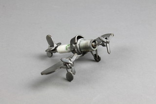 A steel model of a plane with spark plug body 5"