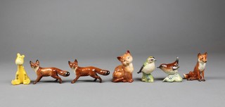 7 Beswick animals, a standing fox 4.5", a seated ditto 3", a goldcrest 2", a wren 2", a seated tigger 3", a seated cat 3" and a standing fox 4" 