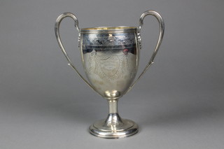 A George III silver 2 handled trophy engraved with floral swags and cartouches with simple scroll handles, terminating in acanthus shoulders, London 1803, approx 21 ozs