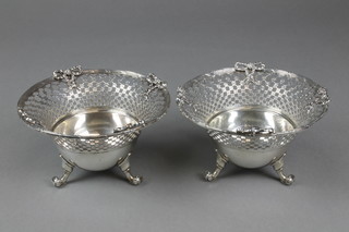 A pair of late 19th Century Continental pierced bowls with ribbon decoration on scroll feet 6.5", approx 20 ozs