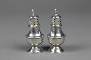 A pair of baluster silver pepperettes, Birmingham 1897, 2"