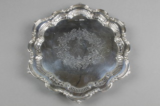 An Edwardian silver card tray with fancy scroll and pierced rim, engraved with formal flowers on claw and ball feet, Sheffield 1902, approx. 8 ozs