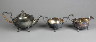 An Art Nouveau silver plated teapot and sugar bowl and a ditto sauce boat, 
