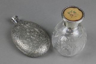 A Persian white metal flattened oval hip flask with symmetrical floral decoration, approx 6 1/2 ozs