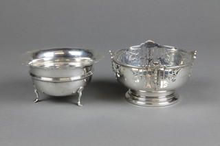 A silver pedestal bowl with pierced decoration, Sheffield 1931, a plain ditto with cut rim on claw feet, approx. 6 ozs 