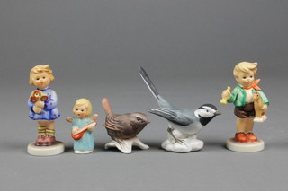 5 Goebels items, boy with toy horse 239/C 4", an Angel 2", a Winter Wren 1 1/2", a girl with flowers 239/a 3" and a tit 3"