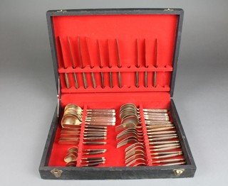 A canteen of bronze cutlery with hardwood handles