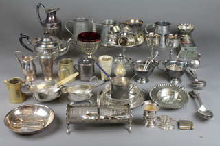 A large quantity of silver plated mugs and vessels