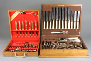 A canteen of Old English pattern cutlery for 6, a canteen of bronze cutlery with hardwood handles