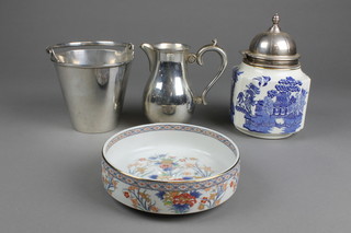 A silver plated mounted biscuit barrel, a jug, pail and ceramic bowl