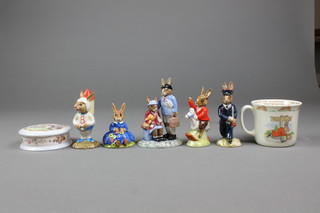 4 Royal Doulton Bunnykins figures - William DB69 4", Postman DB76 4", Astro Rocket Man DB20 4" and Daisy Spring Time DB7 4", a group WWII collection Evacuees DB373 5", a Bunnykins mug, box and cover