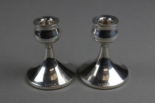 A pair of dwarf silver candlesticks of tulip form, Birmingham 1957 3.5"