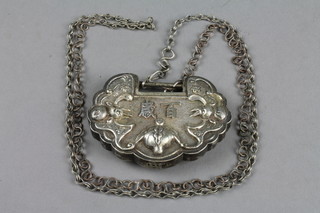 A 19th Century repousse silver buckle decorated with bats and scrolls
