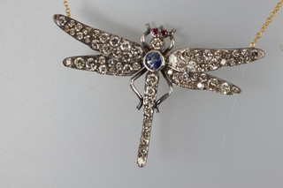 A Victorian style diamond, sapphire and ruby set dragonfly pendant on an 18ct yellow gold chain, approx 2.5cts