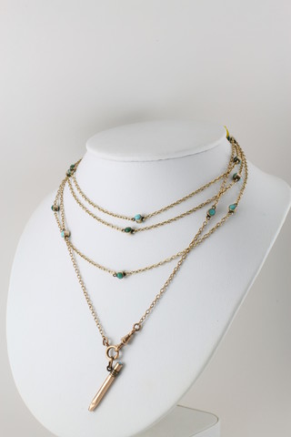 A Victorian gold turquoise set muff chain with a ditto pencil 60"