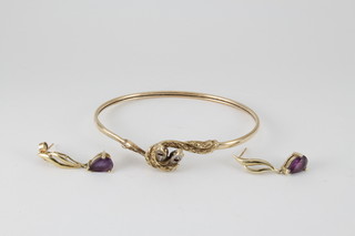 A 9ct gold gem set snake bangle and a pair of ditto amethyst ear studs