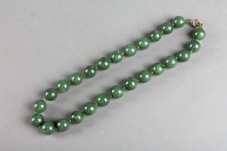 A string of jadeite beads 15"
