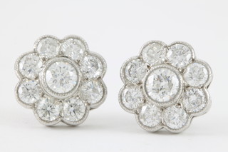 A pair of 18ct white gold diamond cluster 9 stone ear studs, approx 2.6ct