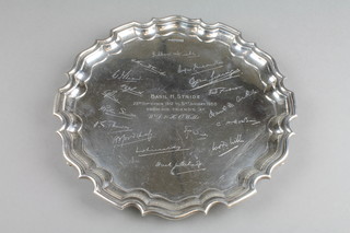 A silver presentation salver with Chippendale rim on scroll feet, Sheffield 1949, approx. 18 ozs 