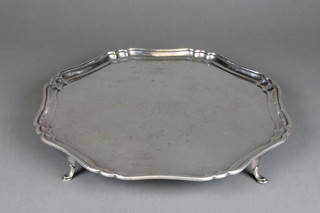 A silver salver with shaped Chippendale rim on hoof feet engraved with a monogram Sheffield 1918, 15", approx. 40 ozs 