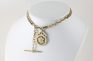 A silver gilt watch chain and sports fob