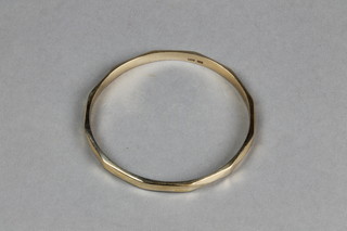 A 9ct gold hollow bangle, approx 10.5 grams