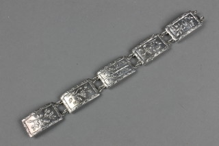 A silver 5 plaque bracelet decorated with flowers and birds