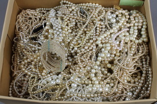 A large quantity of imitation pearl and other bead necklaces
