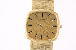 A gentleman's 18ct gold 1970's Piaget automatic wristwatch on a ditto bark finish bracelet, approximate 76.5 grams
