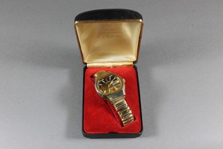 A 1960's gentleman Nordam antimagnetic electrically timed calendar wristwatch on a gilt bracelet