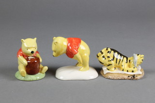 3 Royal Doulton figures - Winnie The Pooh and The Paw Marks W23 4", Tigger Signs the Rissolution WP6 4" and Winnie The Pooh and The Honeypot WP1 2"
