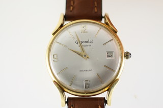 A gentleman's 18ct gold Gigandet wristwatch with calendar dial and cabuchon set winder.