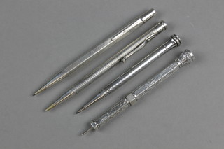 3 engine turned silver propelling pencils, an Edwardian ditto with hardstone end