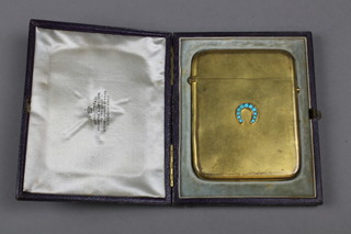 An Edwardian gilt card case set with a turquoise horseshoe in a fitted case