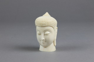 A 19th Century carved ivory bust of a deity 3"
