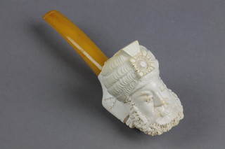 A carved Meerschaum pipe the bowl in the form of a Turks head