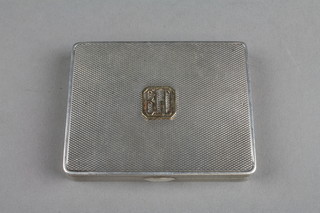 An Art Deco engine turned silver compact, approximately 4 ozs, London 1931 