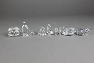 A Swarovski clam, penguin, swan, mouse, owl, bear, goose and chick 