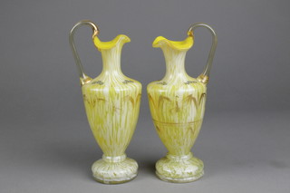 A pair of Victorian opalescent ewers with floral decoration 