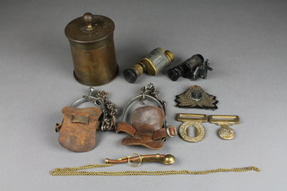 A Trench Art shell case tobacco jar, a minocular, minor badges etc