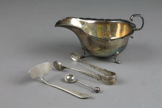 A silver sauce boat Sheffield 1907 and a pair of silver sugar nips, approx 4 ozs and a plated pusher spoon