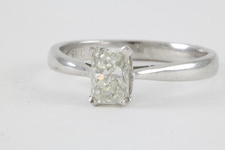 An 18ct white gold single emerald cut diamond ring, approx. 0.60ct